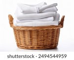 Wicker basket with a stack of white clothes on a white background. Clean, folded, stacked clothes in a wicker basket isolated.