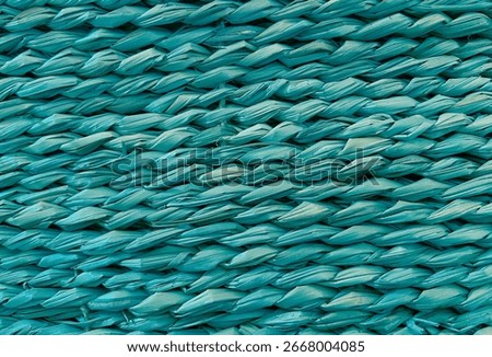 Wicker basket texture background close up. Transformative Teal 2026 color of the year concept. 
