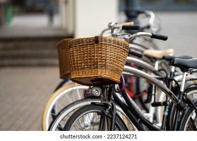 Wicker bicycle baskets close-up. A row of rental bicycles parked on a city street. - Powered by Shutterstock