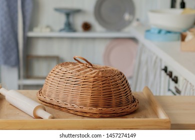 Wicker breadbasket on kitchen table at the photo studio.