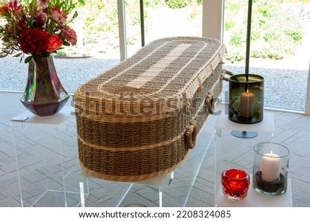 A wicker coffin in a funeral home