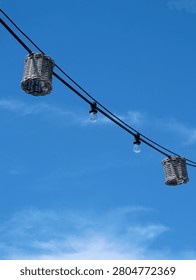 Wicker Lantern String Lights Against Clear Blue Sky, Summer Festival Vibes