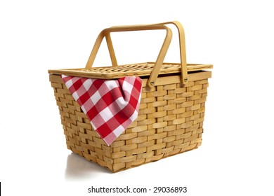 A wicker picnic basket with a red gingham cloth on a white background