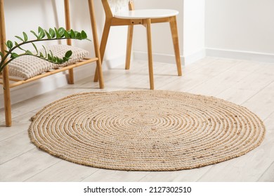 Wicker Rug On Light Wooden Floor In Room