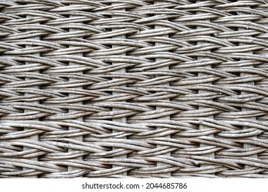 a wicker surface made of wooden rods. the texture of the wicker surface. traditional wickerwork made of wooden twigs