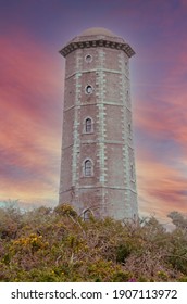 Wicklow Head Lighthouse With Dramatic Sunset Sky