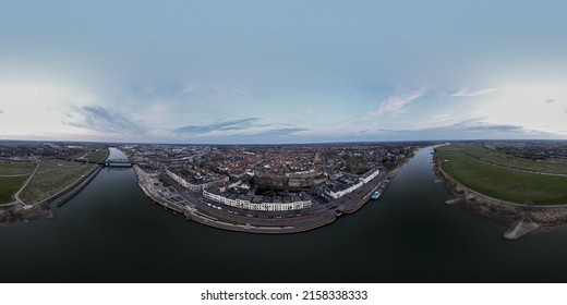 Wide 360 panorama of medieval city seen from across the river IJssel passing the white countenance facades on the boulevard  - Shutterstock ID 2158338333
