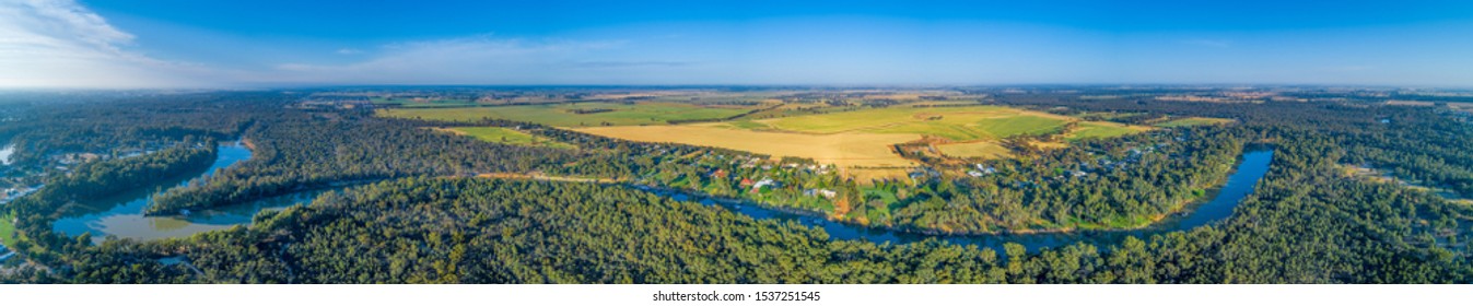 Wide aerial panorama of long stretch of Murray River in scenic countryside