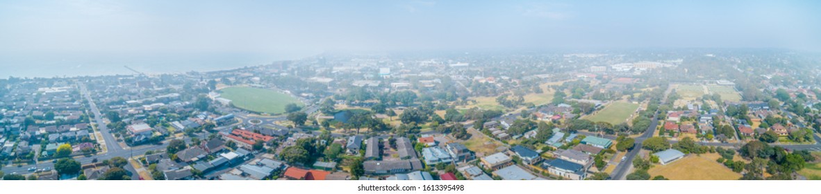 Wide Aerial Panorama Of Suburbs Covered In Smoke Haze From Bush Fires In Gippsland, Victoria, Australia