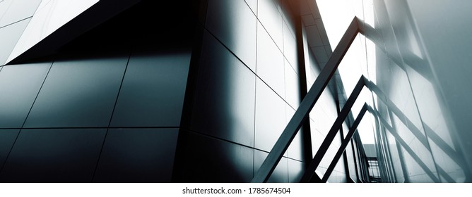 Wide Angle Abstract Background View Of Steel Light Blue High Rise Commercial Building Skyscraper Made Of Glass Exterior. Website Header Or Banner