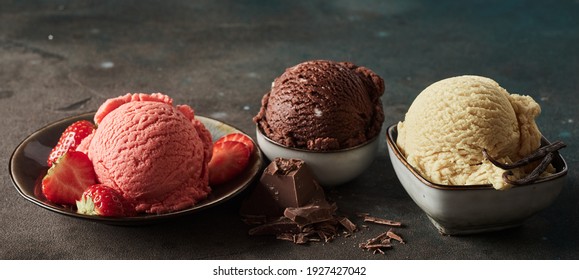 Wide angle of collection of delicious gelati with fresh strawberries and grated chocolate with aromatic vanilla pod