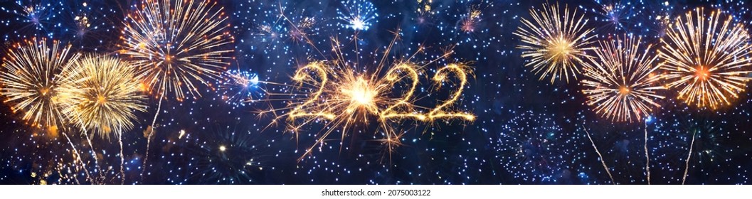 Wide Angle creative holiday header background to New Year 2022. Beautiful Panoramic web banner or billboard with Golden sparkling text 2022 on colorful blue background.