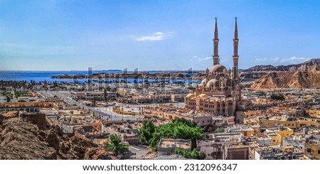 Wide angle drone panorama of Sharm El Sheikh coastline with Al Sahaba Mosque among exotic Egyptian architecture. Beautiful tropical cityscape