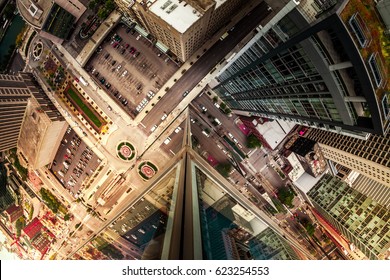 Wide Angle Looking Down At Traffic Intersection In City. Urban Architecture Glass Window Reflection.