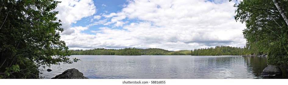 A wide angle panoramic view of the lower Saranac Lake and islands located in the upstate New York Adirondacks.