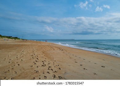 A wide angle photo of an almost empty  beach in Duck, NC. - Powered by Shutterstock