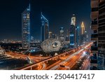 Wide angle photo of Museum of the future on Sheikh Zayed Road. Dubai at night. Tall high skyscrapers.

Translation: "We won