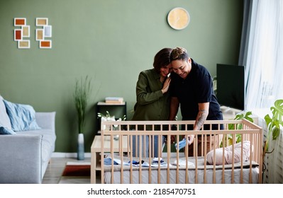 Wide Angle Portrait Of Modern Gay Couple Expecting Baby And Preparing Crib At Home, Happy Same Sex Family, Copy Space