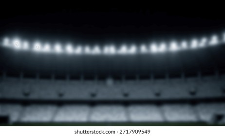 Wide angle shot of an empty stadium at night with bright floodlights illuminating the seats.