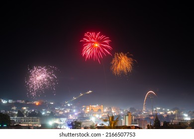 Wide Angle Shot Of Fireworks Above The City During The New Year Festival In India. Celebration Background. Fireworks In The Sky Above The City, Celebration Background. Background Of City With Firework