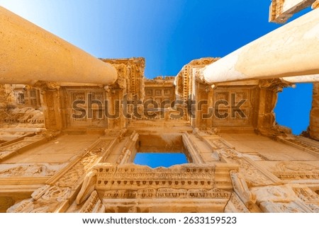 Wide angle shot of Library of Celsus at daytime with blue sky. Visit Turkey concept photo