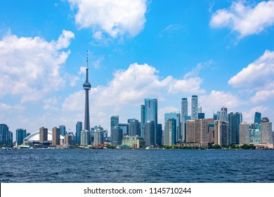 A Wide Angle Shot Of The Toronto City Skyline From A Ferry On A Cloudy Summer Day.