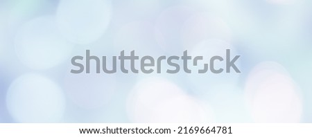 Wide Angle Soft Defocused Light Blue Bokeh Background. Abstract Delicate Blurred Texture. Beautiful Backdrop With Copy Space for design. Panoramic header for website.