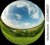 Wide angle spherical panorama view of a river valley with a meadow and trees on a summer day. The photo was taken through a circular fisheye lens. Fulldome format