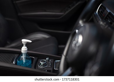 Wide Angle View Of Bottle Of Blue Sanitizer Ethyl Alcohol Hand Gel Cleanser Put In The Car, Prepare For Protecting Coronavirus, COVID19 