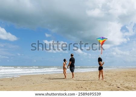 Similar – Image, Stock Photo Flying rainbow kites coast