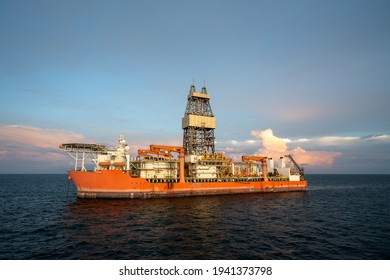 Wide Angle View Of Deep Water Drill Ship Carrying Out Drilling At Oil Field.