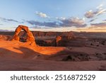 A wide angle view of Delicate Arch at sunset in Arches National Park, Utah, USA