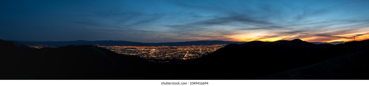 Wide Angle View of Downtown San Jose at Night with Orange Skies over the Mountains