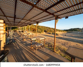 Wide Angle View Of Empty Shooting Range Bays At An Old Outdoor Shooting Range.