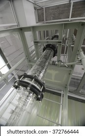 Wide Angle View Of Extraction Column In Laboratory With Ladder And Metal Plating Around It