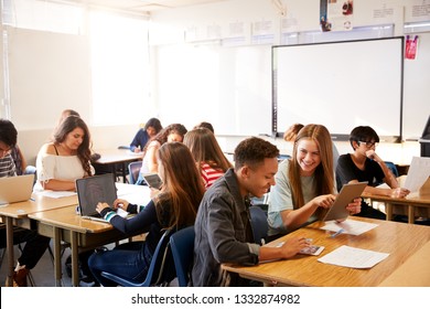 Wide Angle View Of High School Students Sitting At Desks In Classroom Using Laptops - Shutterstock ID 1332874982