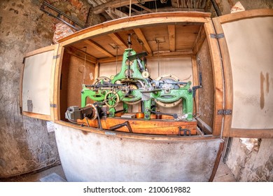 Wide angle view of a large clock mechanism in a church.