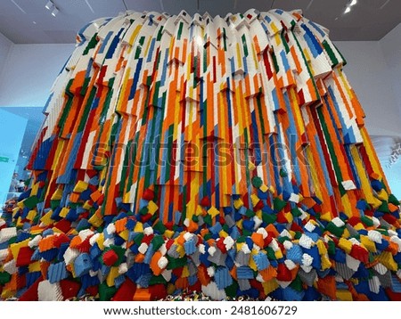 Wide angle view of the multi colored Lego waterfall