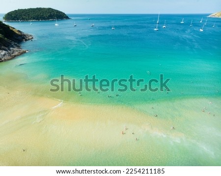 Wide angle view Nai Harn beach at phuket island on January 26-2023, Beautiful beach in thailand, Amazing High angle view sea in phuket Island with blue sky cloudy background, Travel holiday Concept