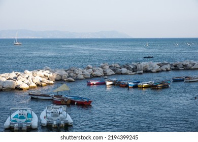 Wide Angle View Of Naples Coast With Sea, Rocks And Boats