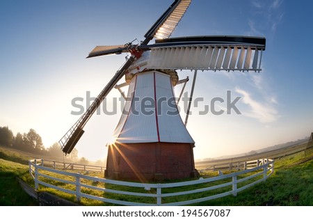 wide angle view on windmill at sunrise, Netherlands