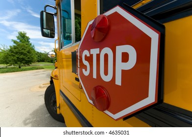 Wide Angle View Of School Bus Stop Sign On Sunny Day