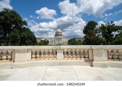 Wide Angle View Of The United States Capitol Building In Washington DC On A Partly Cloudy Summer Day