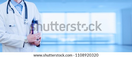 Wide background of doctor's business card. Medical education. A student holds books under his arm. faceless promotional banner.