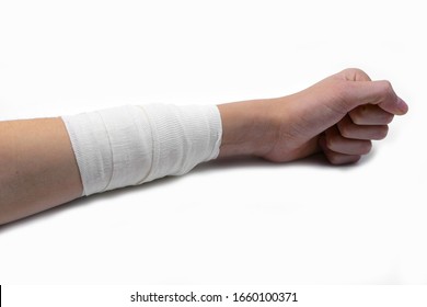 Wide Bandage With A Sterile Gauze On An Arm Of A Boy On White