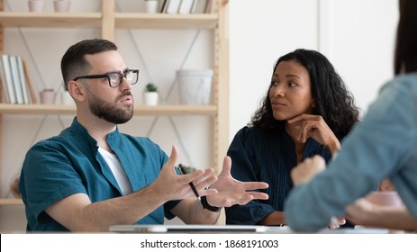 Wide banner close up of view of diverse employees talk discuss company business ideas at meeting in office. Motivated multiracial businesspeople brainstorm cooperate at briefing. Teamwork concept. - Powered by Shutterstock