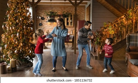 Wide Banner Panoramic View Of Happy Young Caucasian Family With Two Small Kids Have Fun Celebrating Christmas At Home. Overjoyed Parents With Children Enjoy New Year Winter Holidays Together.