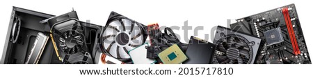 wide banner of parts and components for modern desktop computer. Mainboard power supply RAM SSD hard disk CPU cooler graphics card and midi tower pc case isolated white panorama background 