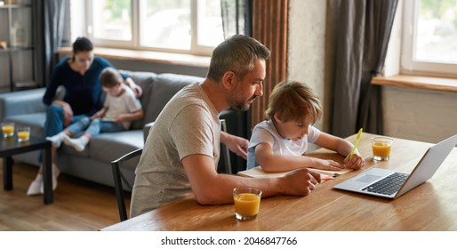 Wide Banner Shot Of Caring Caucasian Father And Small Teen Son Learn Writing Study Online At Home With Computer. Dad Help Little Boy Child With School Homework Assignment. Distant Education Concept.