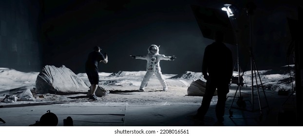 WIDE Behind the scenes, cinematographer shooting viral video for social account on a large Moon landing set. Virtual production with LED screens - Shutterstock ID 2208016561